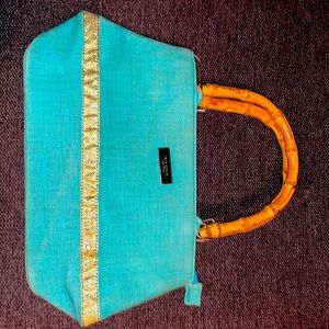 Kate Spade New York handbag with bamboo handles.